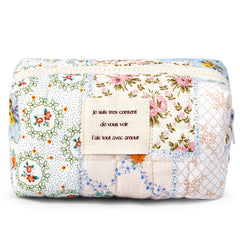 Sminra bollo maquillaje floral azul frente, perfecto para ordenar productos durante el viaje