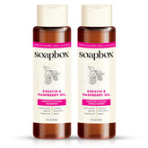 Soapbox Shine champú de keratina en botella, domando frizz y brillo.