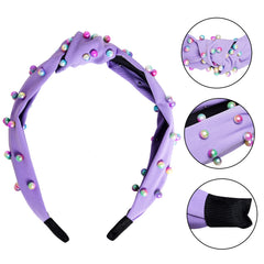 Diadema Sucrain de perlas sintéticas con nudo cruz púrpura, añade color sutil.