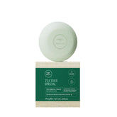 Tea Tree Special Shampoo Bar, disque solide, nettoyage en profondeur et parfum vivifiant.