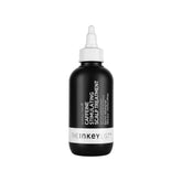 The INKEY List caffeine scalp treatment bottle for stimulating the scalp.