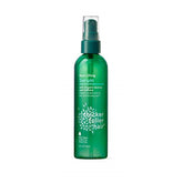Sérum Thicker Fuller Hair en la botella verde para levantar la raíz
