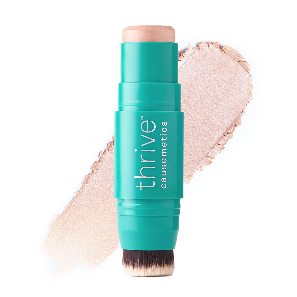 Thrive Causemetics Joy: iluminador crema dorado para realzar pómulos con brillo sutil.