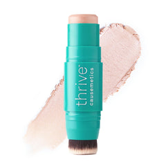 Thrive Causemetics Joy: iluminador crema dorado para realzar pómulos con brillo sutil.