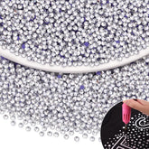 Piedras hotfix claras de TINKRSTUFF, SS10, brillo duradero para textiles.