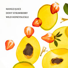 Touchland Mango Mojo mist applied to hair for refreshing scent