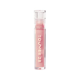 Tower 28 ShineOn Lip Jelly OAT frente al envase, tono rosado lechoso para labios hidratados.