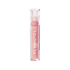 Tower 28 ShineOn Lip Jelly OAT frente al envase, tono rosado lechoso para labios hidratados.