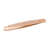 Pinzas Tweezerman Rose Gold Mini Slant con puntas afinadas para depilar cejas con precisión.