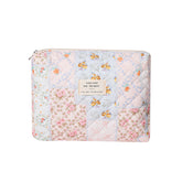 Bolsa de maquillaje uekeboag con diseño floral acolchada, ideal para organización diaria.