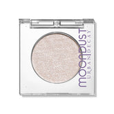Sombra Space Cowboy de Urban Decay Moondust, aplicación suave y brillo intenso.