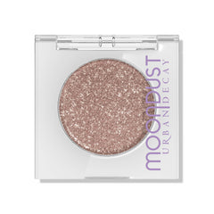 Sombra URBAN DECAY Moondust Space Cowboy con brillo intenso y wet look.