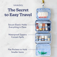 Organizador VANDEL con cuatro compartimentos para cosméticos durante el viaje.