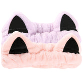 Diadema Waliah orejas de gato rosa para mantener el cabello alejado durante la limpieza facial.
