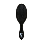 Wet Brush Original Detangler negro, pelo húmedo, desenredo suave sin tirones.