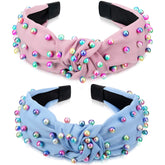 Diadema WILLBOND con perlas y nudo cruzado rosado, añade elegancia diaria.