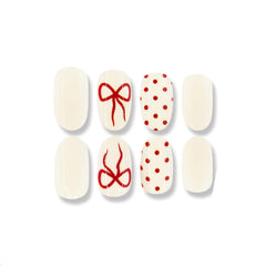 Uñas postizas WUHCIM brillantes con lazo rojo para ocasiones especiales.