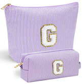 YOOLIFE bolso maquillaje inicial morado frente, ideal para organizar tus esenciales.