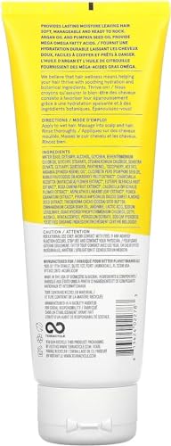 Acure Ultra Hydrating Conditioner being applied to mid-length hair for moisture