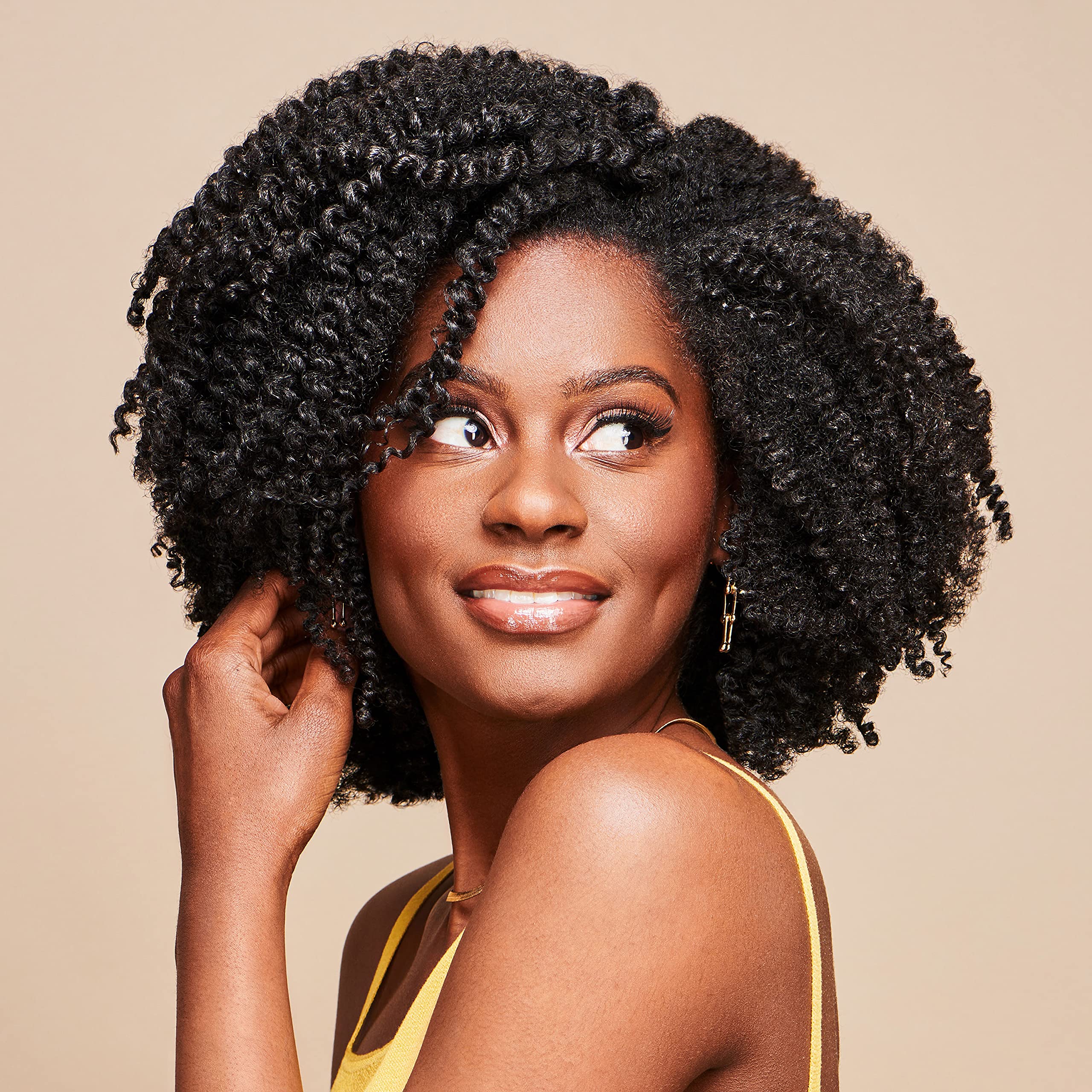 African Pride Moisture Miracle con baobab para fortalecer y sellar la humedad.