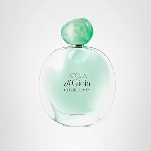 Presentación con toque joya verde: estuche y botella que evocan naturaleza.