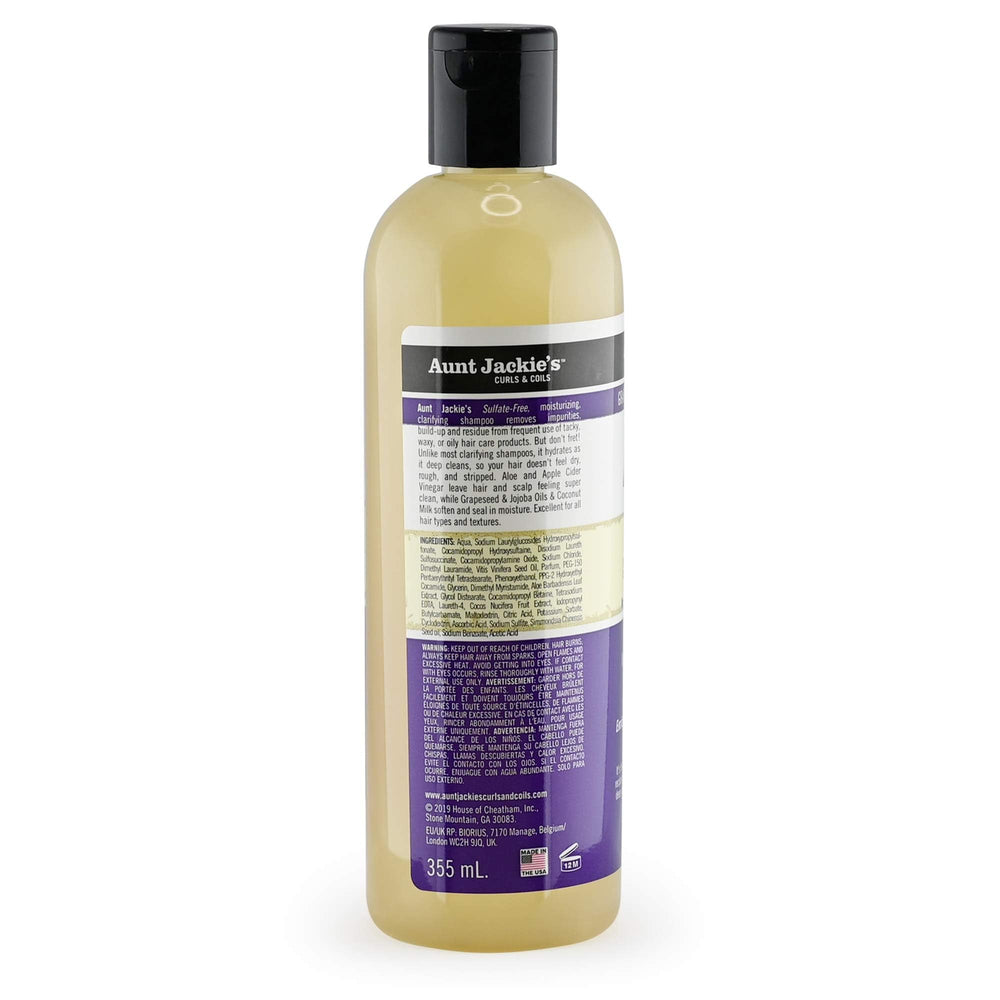 Aunt Jackie's Power Wash bottle tilted, ready to cleanse and hydrate hair.
