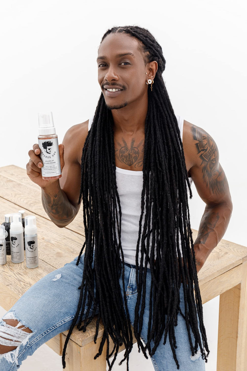 Avenue Man Volume Lift Mousse with green tea leaf cue suggesting antioxidants and refresh.