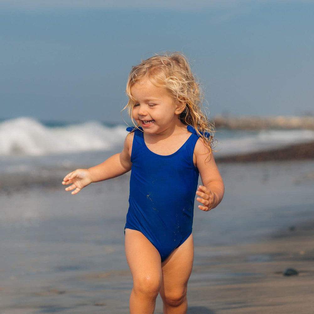 Envase 50% PCR de Badger Kids SPF 40, fabricado con energía solar.