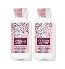 Loción Bath & Body Works A Thousand Wishes en botella, hidratación suave y fragancia duradera.
