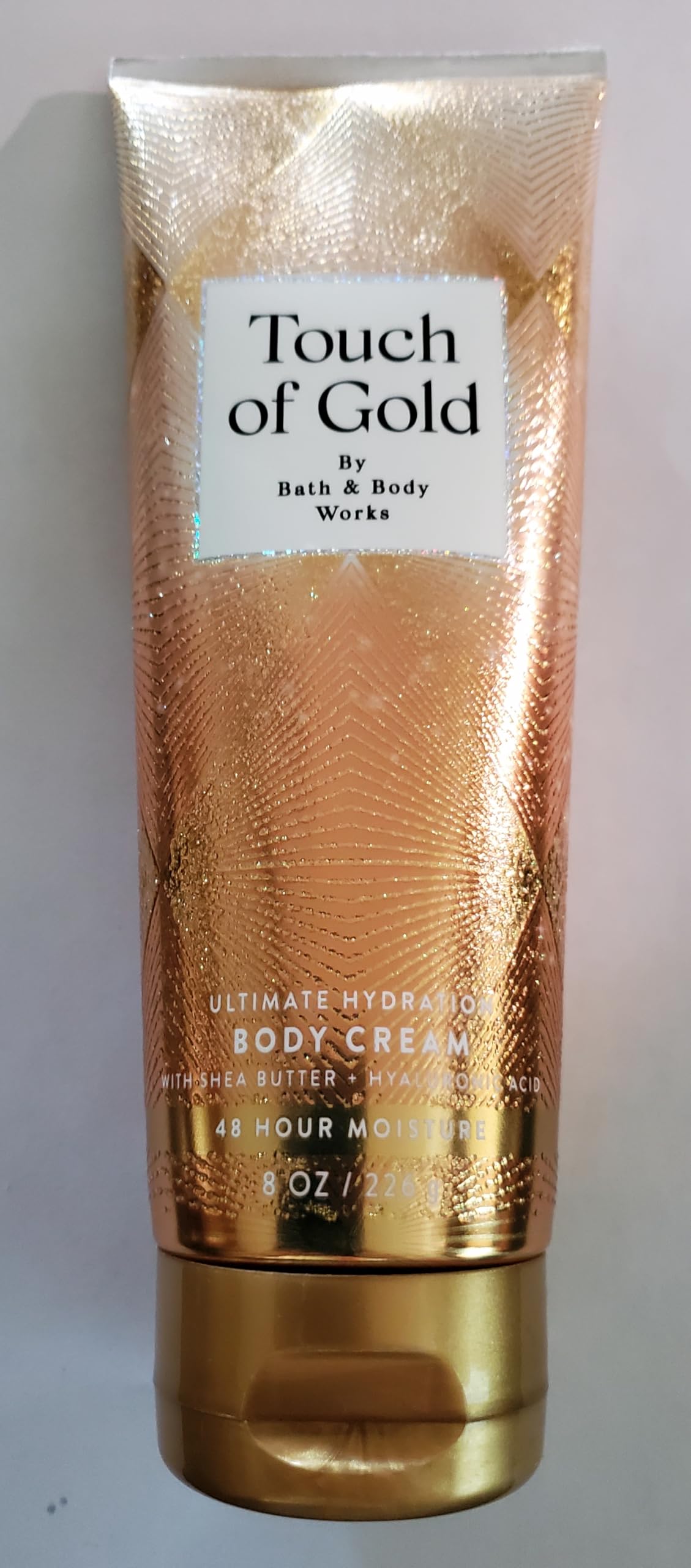 Bath & Body Works Toque de Oro, textura cremosa para absorción rápida.