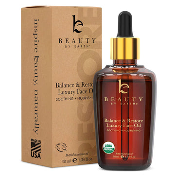 Beauty by Earth: botella de Aceite Facial Balance & Restore para piel equilibrada y suave.