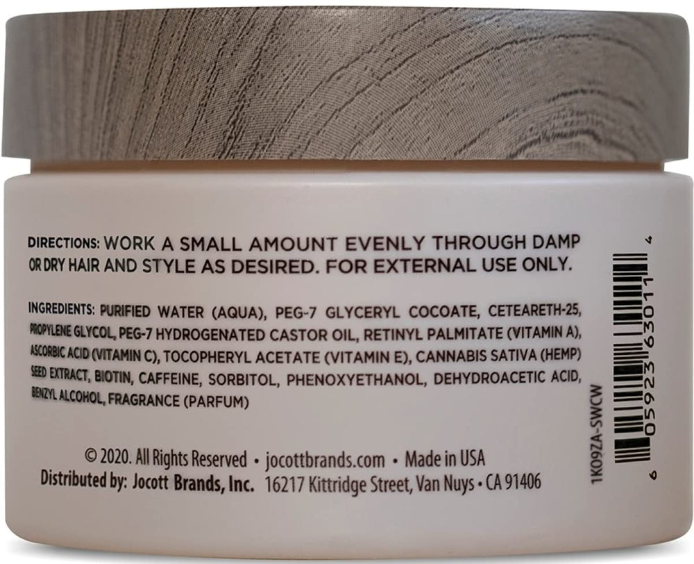 Close-up of hands applying Blackstone pomade showing smooth texture and easy work-through.