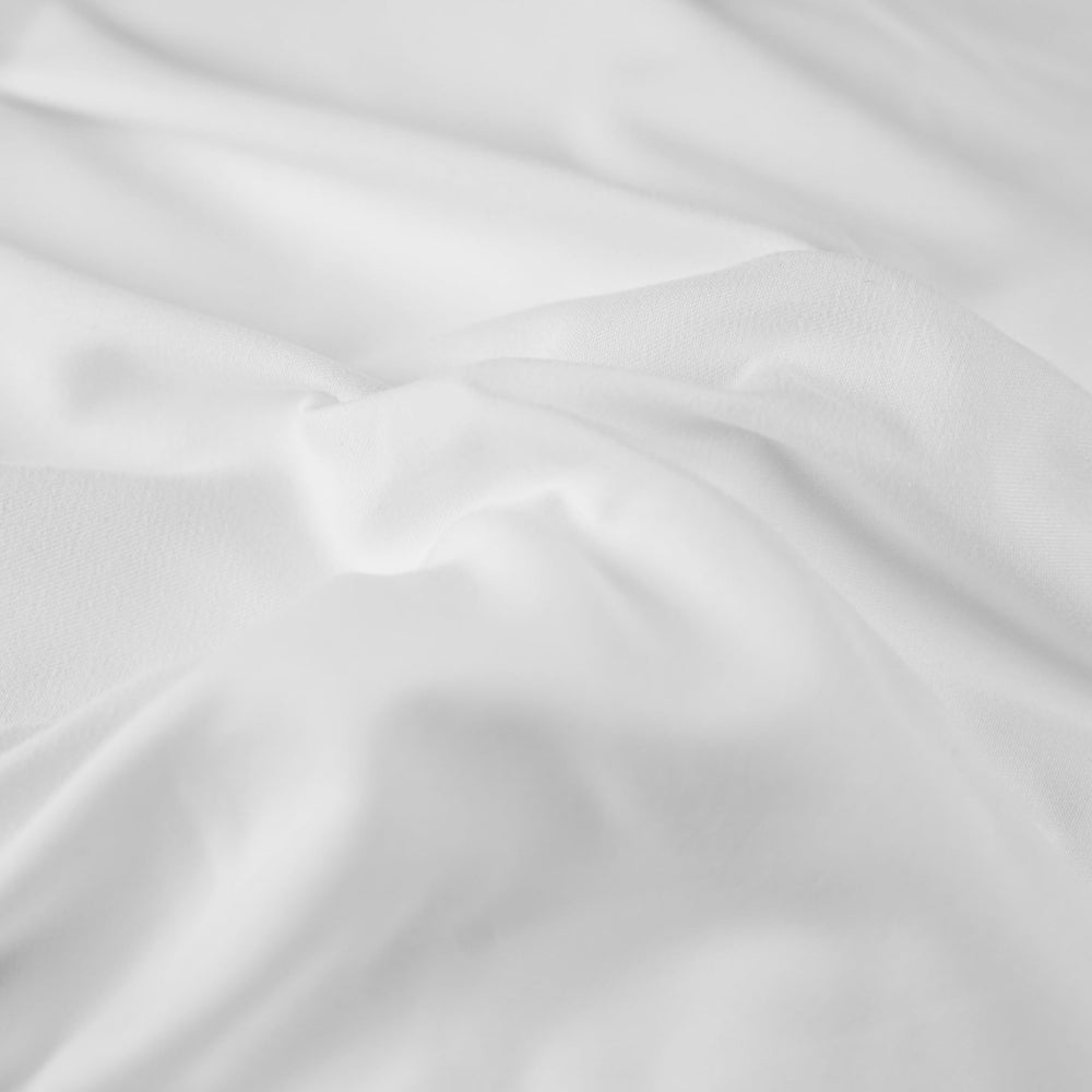 Body Linen Tranquilidad funda para rostro sobre reposacabezas durante masaje.