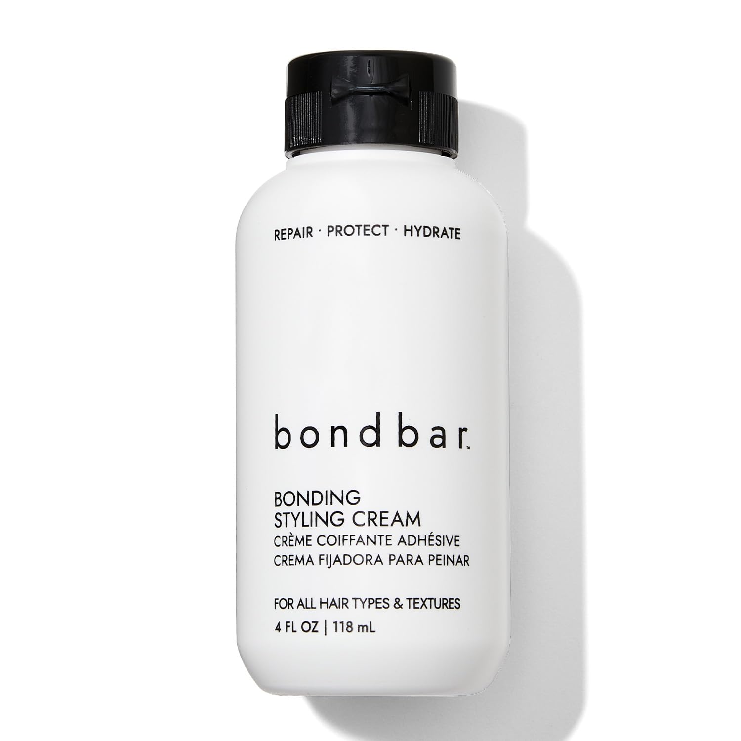 Bondbar crema para peinado, botella visible, ayuda a reparar y suavizar el cabello.