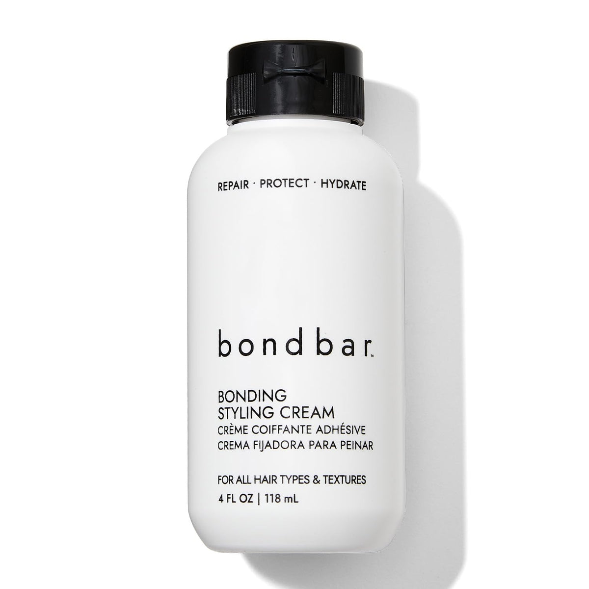 Bondbar crema para peinado, botella visible, ayuda a reparar y suavizar el cabello.