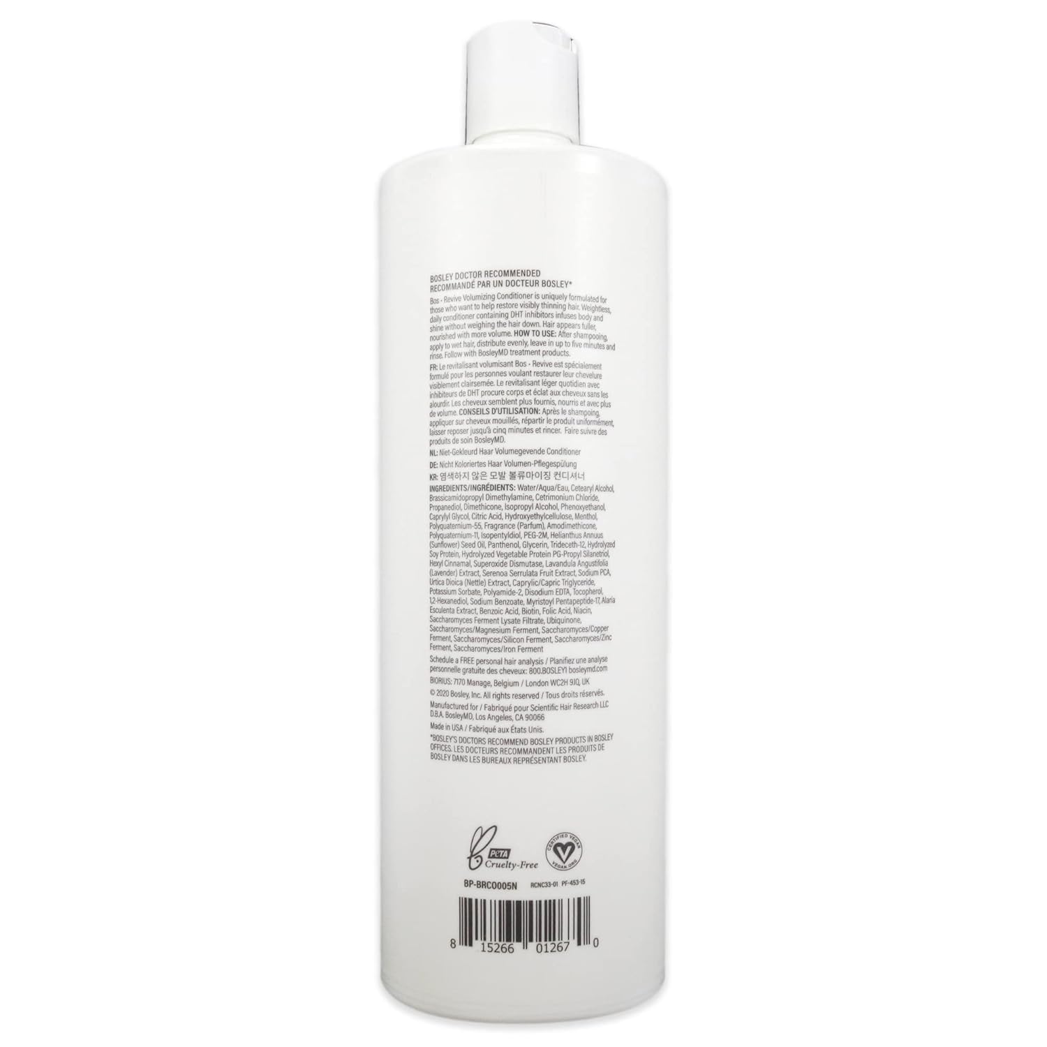 Botella BosRevive en baño, cabello con cuerpo y brillo.