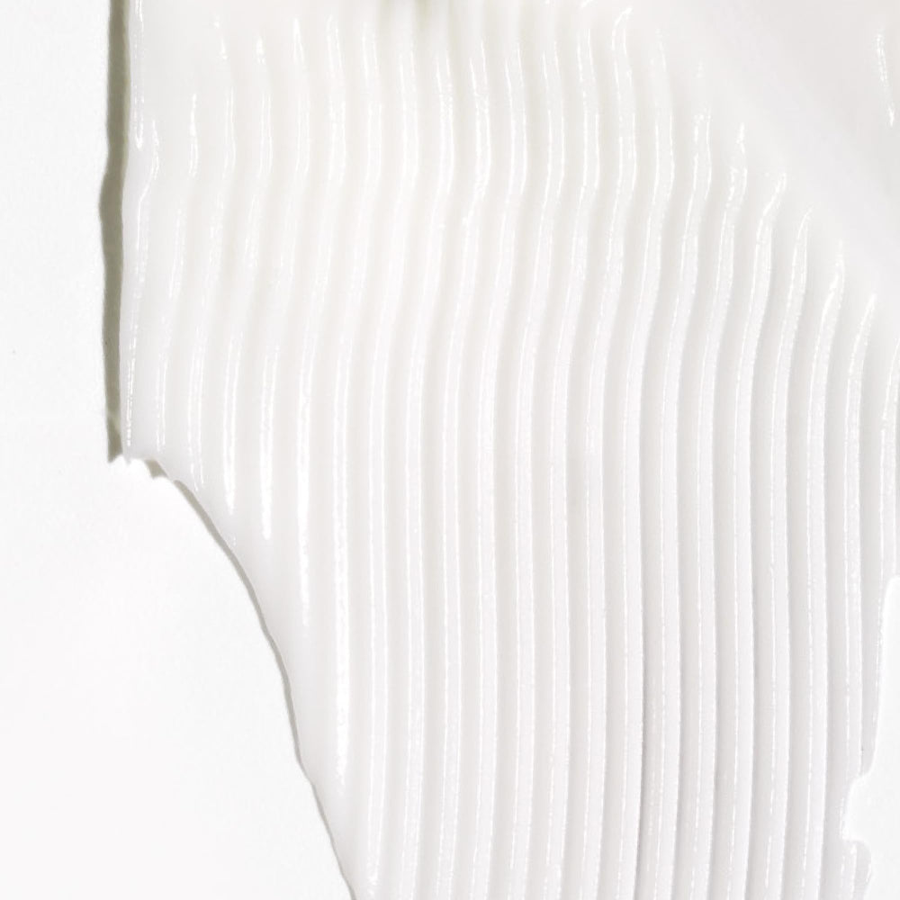 Creamy texture of Briogeo Don't Despair, Repair! conditioner for smoothing.