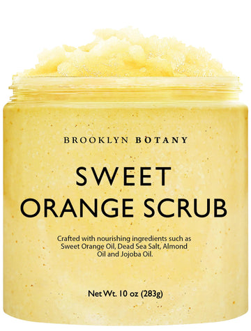 Brooklyn Botany Sweet Orange Scrub, botella vertiendo, exfolia suavemente la piel.