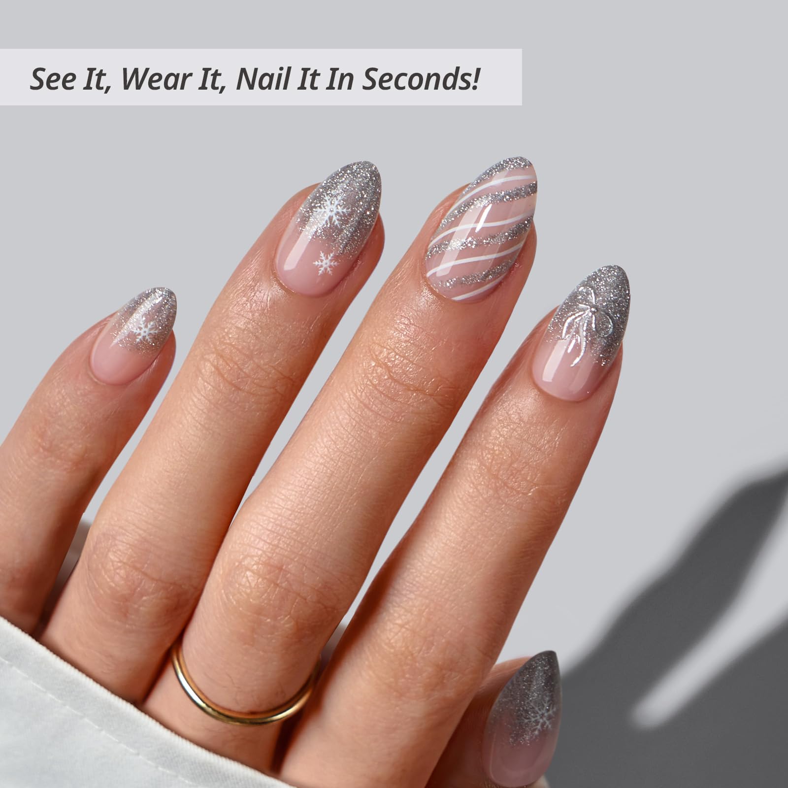 BTArtbox Uñas Prensadas Sparkle Bow, mano con uñas en forma almendra para estilo diario.