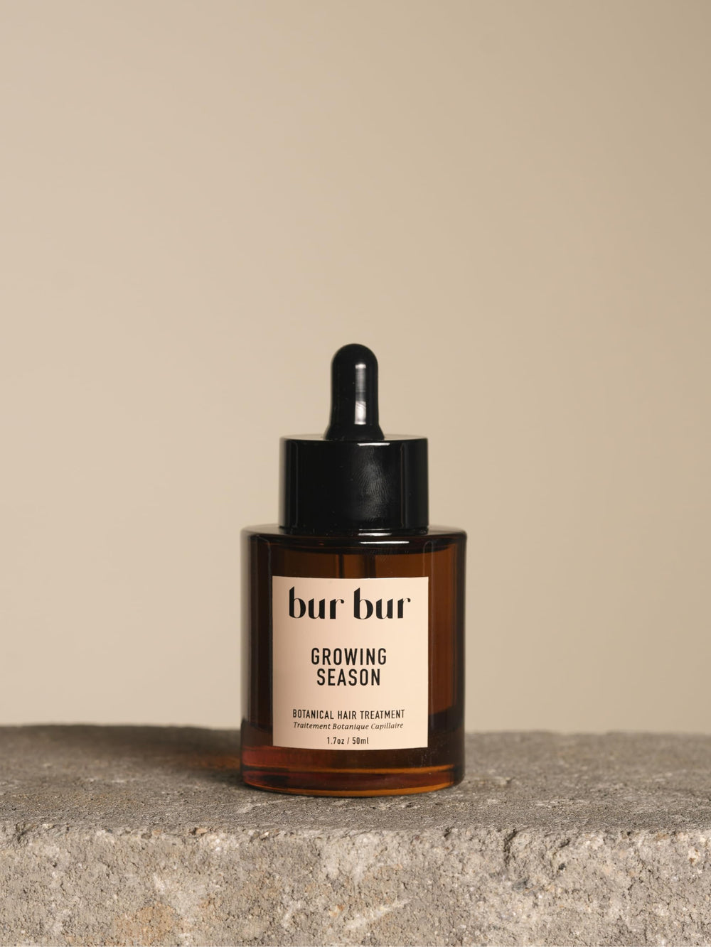 Bur Bur Aceite Crecimiento, botella en primer plano para cabello nutrido y suave