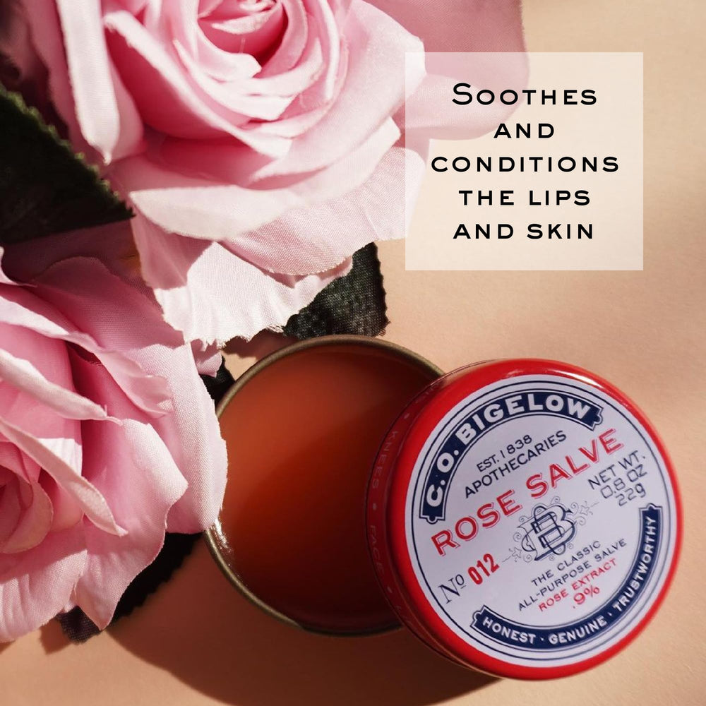 C.O. Bigelow Rose Salve Tin on hands for quick dry-skin relief.