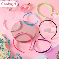 Diadema satinada Candygirl para fiestas y looks elegantes.