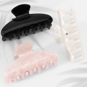 Pinza Canitor acrílica marmolada crema, opción discreta para recogidos elegantes.