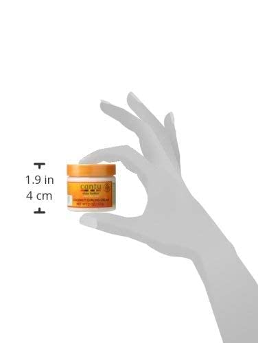 Cantu crema para rizos coco, enfoque textura crema, hidrata y define rizos sin encrespamiento.