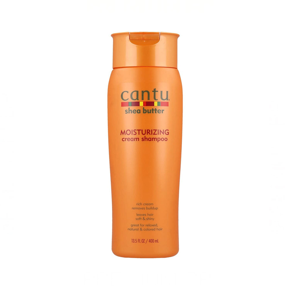 Champú crema Cantu con manteca de karité, frasco visible para nutrición profunda.