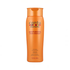 Champú crema Cantu con manteca de karité, frasco visible para nutrición profunda.