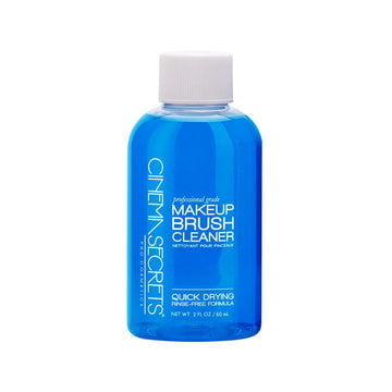 Cinema Secrets limpiador de pinceles Vanilla, frasco azul, aroma suave que refresca pinceles.