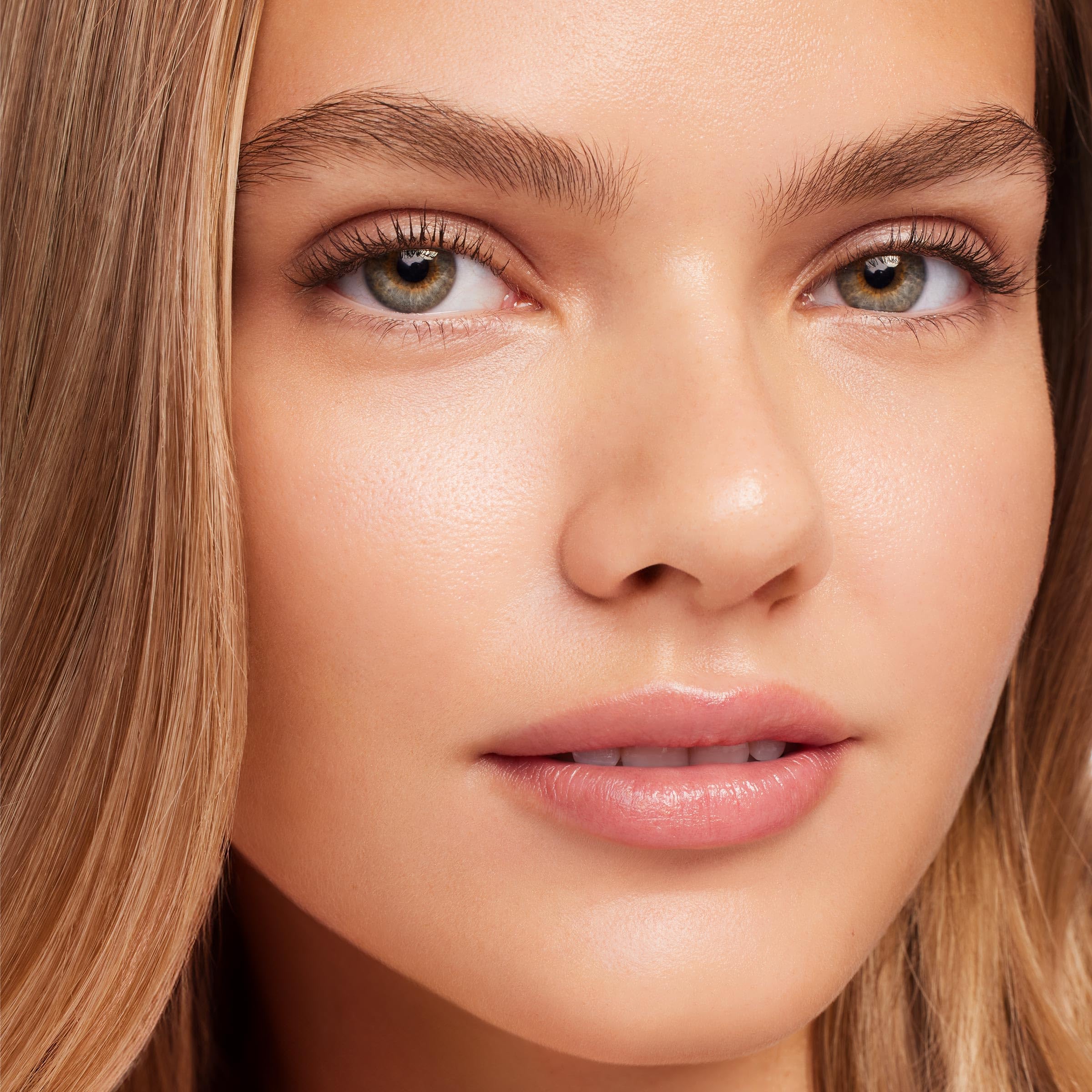 ColourPop Brightening Vitamin C Serum Stick glow on skin showcases dewy finish.