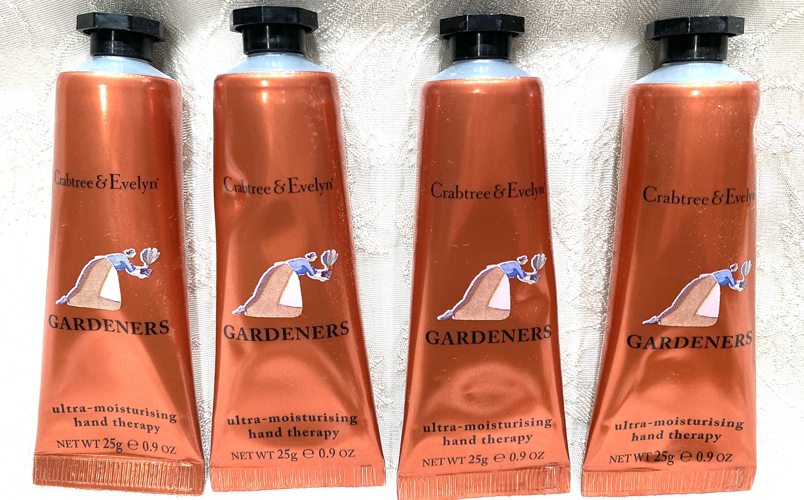 Crabtree & Evelyn, crema para manos en tubo; enfoque en envase, hidrata para uso diario.