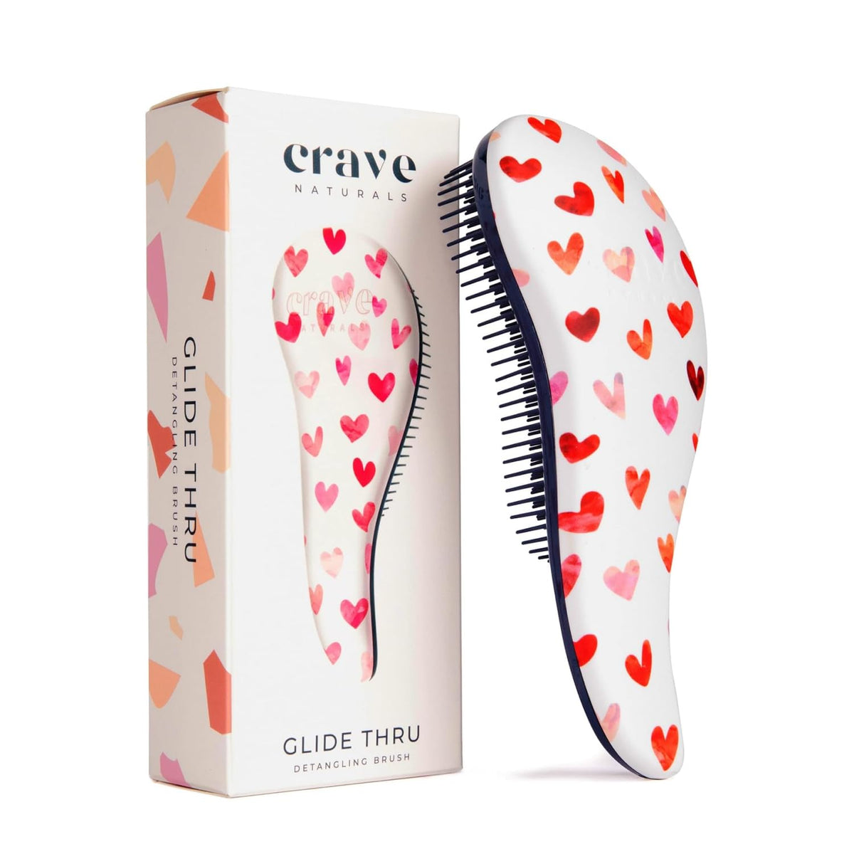 Cepillo Crave Naturals Glide Thru con corazones rosas para uso diario suave.